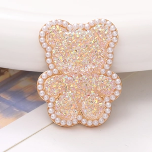 Detail of bear charm with gold alloy edges, white pearls and AB rhinestones for DIY
