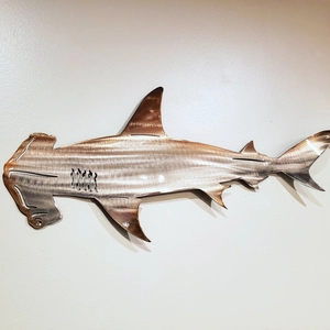 Artistic hammerhead shark wall decor in stainless steel with a bronze metallic finish
