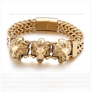 Detail of gold lion head punk bracelet in stainless steel with weave chain links