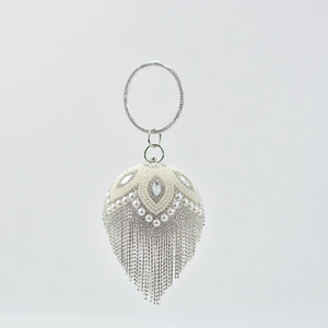 Spherical white pearl and silver rhinestone evening clutch bag with ring handle and tassel