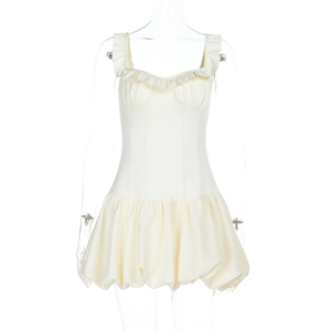 Detail of white mini dress with ruffled neckline and voluminous bubble hem design