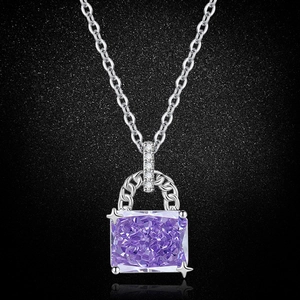 Detail of square-cut purple gemstone pendant with star-prong setting on silver chain