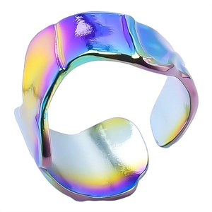 Detailed view of iridescent stainless steel open ring with irregular wavy texture