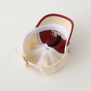 Detail view of cotton baseball cap interior with sweatband and adjustable metal buckle
