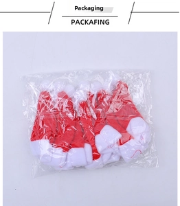 Bulk pack of mini red and white non-woven Christmas hats for cutlery and bottle decor