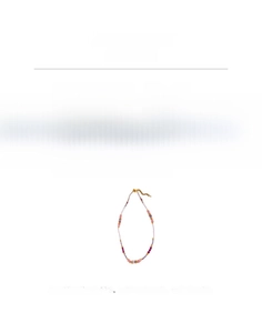 Macro view of multi-color natural stone beaded necklace with lobster clasp and extension chain