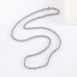 Classic silver stainless steel cross chain necklace with lobster clasp on white background