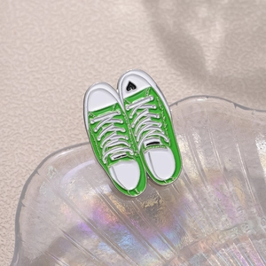 Green high-top canvas sneaker enamel pin set with heart detail and zinc alloy finish