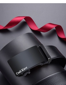 Macro shot of men's leather belt with black matte automatic buckle and gift ribbon