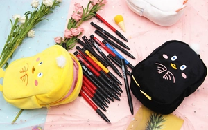 Detail of plush animal pencil cases showing soft texture and large interior capacity