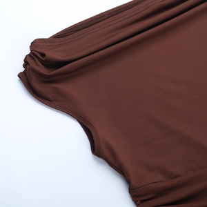 Detail of dark brown elastic fabric with flat double-needle stitching and side ruching