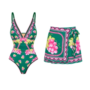 Detail of deep V-neck swimsuit with floral print and matching wrap skirt set