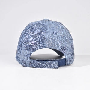 Detail view of the adjustable velcro strap on a blue glitter star baseball cap