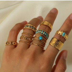 Detailed view of bohemian style 18k gold plated titanium steel ring set on satin