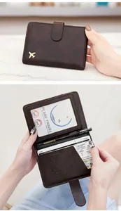 Detailed interior of dark brown PU leather passport holder with RFID blocking and SIM slots
