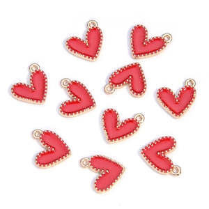 Macro view of multiple red heart enamel pendants with golden beaded edge for DIY jewelry