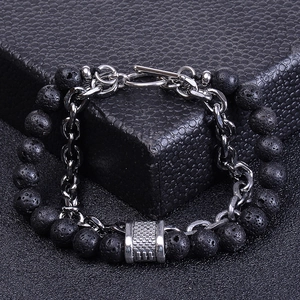 Close-up of men's double-layer bracelet with volcanic stone beads and silver metal chain
