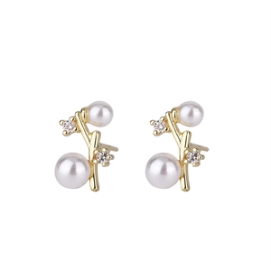 Elegant gold twig stud earrings with white pearls and sparkling cubic zirconia accents