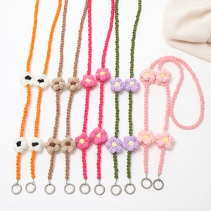 Handmade knitted flower bag straps in vibrant colors with metal rings for phone cases