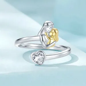 925 sterling silver mother and child open ring with heart-shaped zircon on blue background
