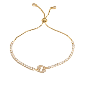 Detail of adjustable gold-tone Cancer zodiac bracelet featuring sparkling white crystals