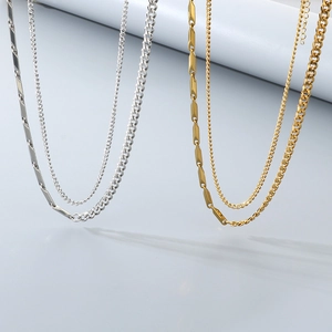Double-layered Cuban link chain necklace in silver and gold metal finishes