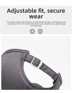 Detail of grey mesh cap showing breathable fabric, reflective trim, and metal adjustment buckle