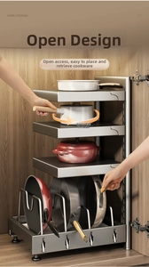Detailed close-up of multi-layer metal kitchen rack showing adjustable shelves and pans