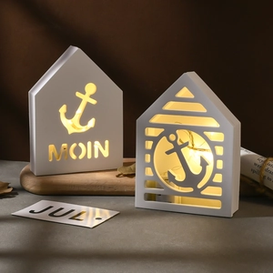 Nautical lighthouse cabin LED night lights with anchor cutout and warm interior glow