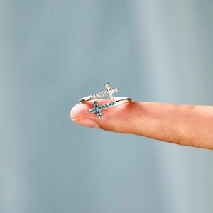 Minimalist S925 sterling silver open ring with crossing blue and white cubic zirconia