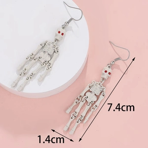 Gothic skull skeleton drop earring with red rhinestone eyes, size 7.4cm by 1.4cm