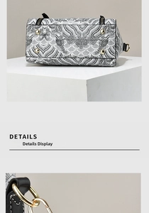 Detail of contrast embroidery handbag showing gold hardware and protective bottom studs
