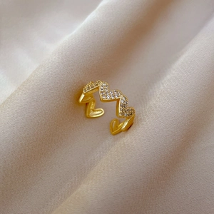 Macro view of gold plated adjustable heart ring with micro inlaid cubic zirconia stones