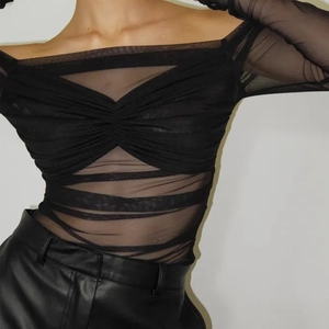 Close-up of black mesh off-shoulder top with ruching details and sheer long sleeves