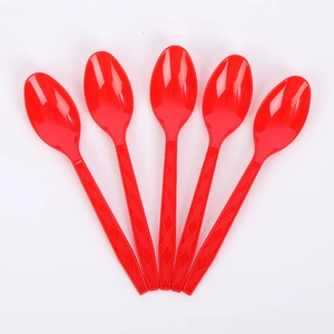 Detail of five red plastic spoons with diamond textured handles for Valentine's Day party
