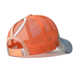 Detail view of tie-dye visor baseball cap with orange mesh back and ponytail hole