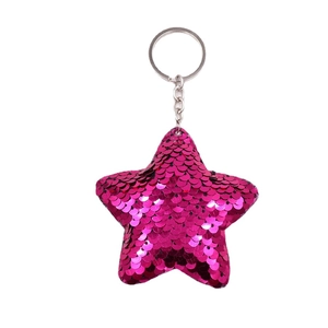Star-shaped sequin keychain in rose red color with metallic ring on white background