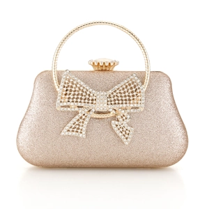 Champagne gold glitter evening clutch bag with large rhinestone bow and metal handle