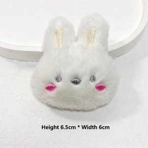 Close-up of white plush bunny doll with embroidery details, size 6.5cm by 6.0cm