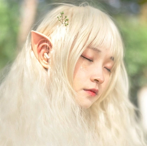 Cosplay elf ears and long wavy light blonde wig for fantasy and Halloween costume