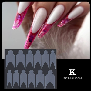 Detailed view of clear nail extension molds and long stiletto marble design nail tips