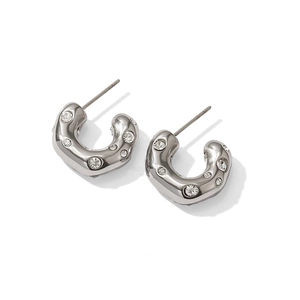 Polished silver U-shaped titanium steel earrings with sparkling inlaid crystals on white background