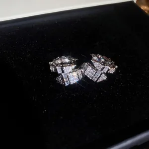 Luxurious silver snake-shaped C-clamp earrings with sparkling zircon pave setting