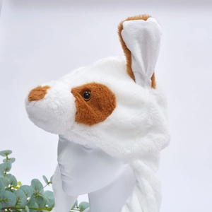 Detailed close-up of soft white plush animal hat with brown spots on a model head