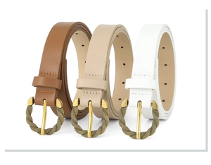 Detailed view of three PU leather belts with twisted gold round buckles in brown, beige, white