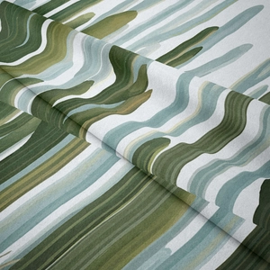Detail of bohemian tapestry fabric showing abstract wave patterns and soft textile texture