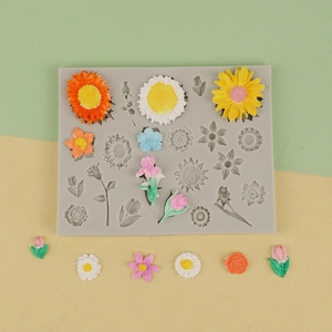 Close-up of sunflower and daisy silicone mold with colorful DIY floral fondant pieces