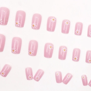 Pink press-on nails with white daisy patterns and square shape for a sweet daily look