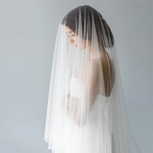 Minimalist white two-layer bridal veil in soft tulle for elegant lawn weddings