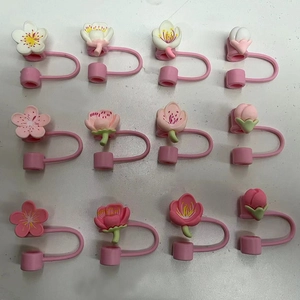Set of 12 silicone peach flower straw toppers for Stanley cups in assorted pink colors